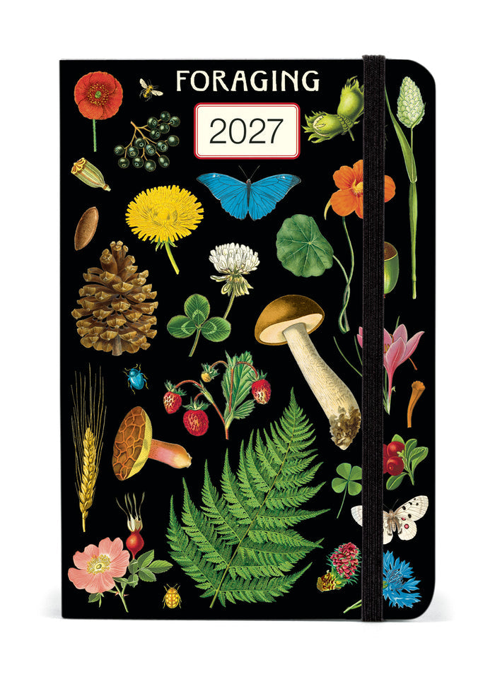 2027 Cavallini & Co. Foraging Weekly Planner with a black cover decorated with vintage-style botanical illustrations including flowers, mushrooms, a fern, a pinecone, berries, and a butterfly. The elastic closure band is black.