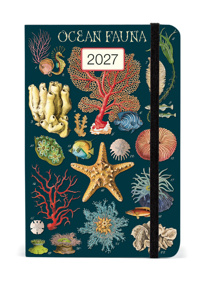 2027 Cavallini & Co. Ocean Fauna Weekly Planner has a dark teal cover decorated with vintage-style illustrations of sea stars, coral, shells, and marine life. A white label on the cover displays '2027'.