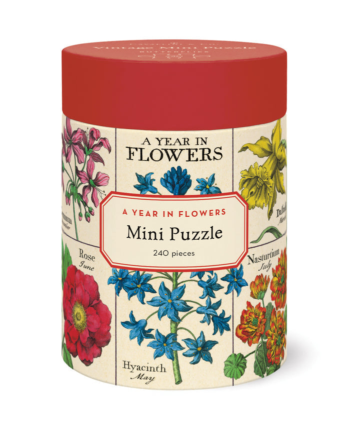 cylindrical puzzle box with floral design and 'A Year in Flowers' text