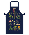 Cavallini & Co. Herbarium Cotton Apron features reproductions of vintage scientific images, complete with scientific names. The detailed images stand out on the dark background.