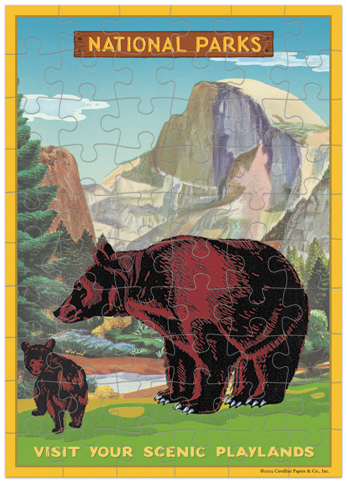 Jigsaw puzzle greeting card with a bear and mountain design, featuring text about National Parks.