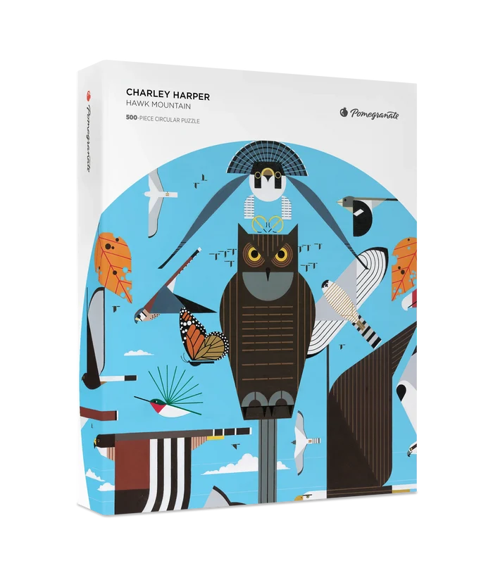 Charley Harper Hawk Mountain 500 Piece Circular Puzzle- Pomegranate puzzle box with Charley Harper artwork featuring an owl and other birds on a blue background.