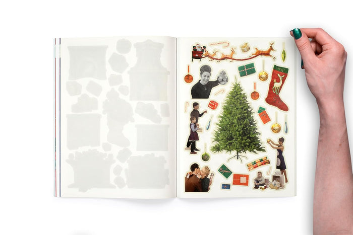 Open book with Christmas-themed stickers on a white background