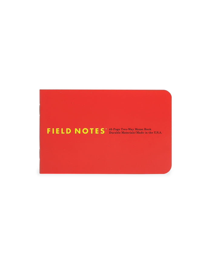 Red notebook with 'Field Notes' branding on a white background