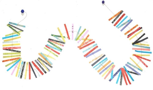 The handmade lokta paper stripes garland is made of strips of handmade paper that is sewn into a 5 foot long garland.