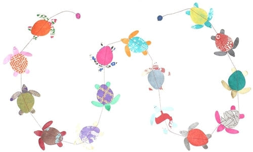 Handmade Lokta Paper Turtle Garland features unique paper turtles made from patterned paper.