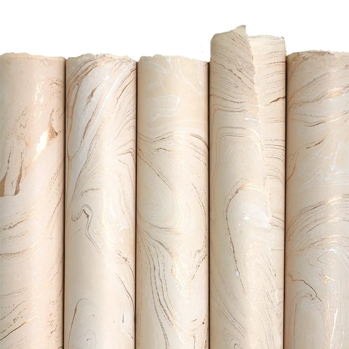Handmade Marbled Paper- Cream with Gold 5 sheets rolled to show pattern variations