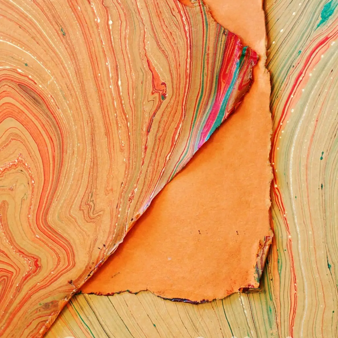 Handmade Marbled Papers- Orange with Green, Red, Gold showing front and back sides with edge deckle