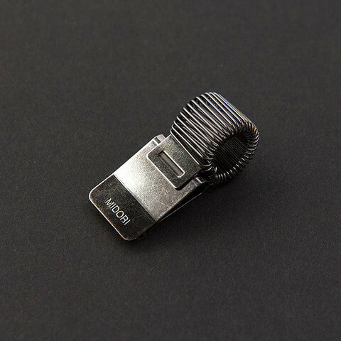 Midori Miniclip Pen Holder slides over leather or board covers and clamps securely in place.
