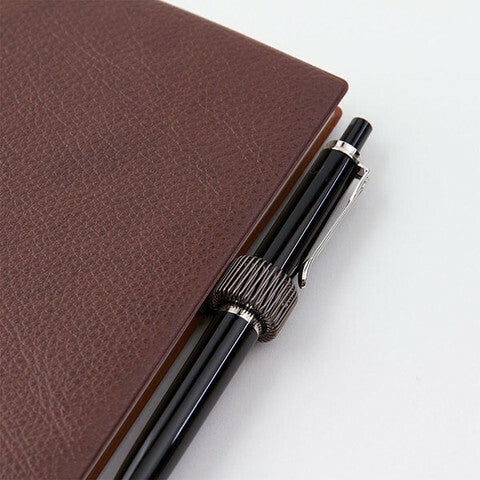 Spring clip expands to hold most any pen or pencil.