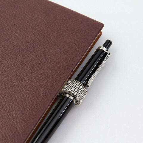 Spring clip expands to hold most any pen or pencil.