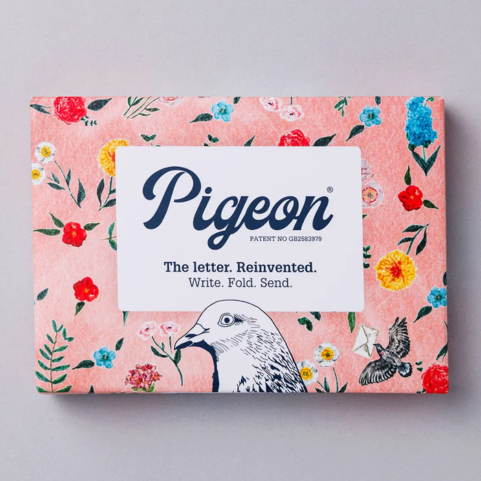 Pigeon letter writing kit packaging with illustrations of flowers in a variety of colors on a pink background.