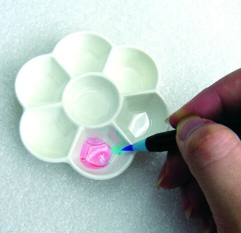 Dip the end of the brush pen in water to create washes blend colors more easily.