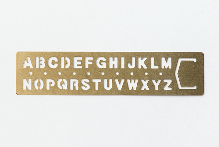 The Midori Traveler's Notebook Alphabet Brass Bookmark will change over time as you use it, making it more personalized.