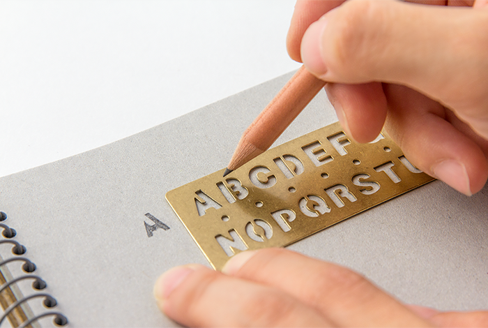 Use the Midori Traveler's Notebook Alphabet Brass Bookmark to make clear letters.