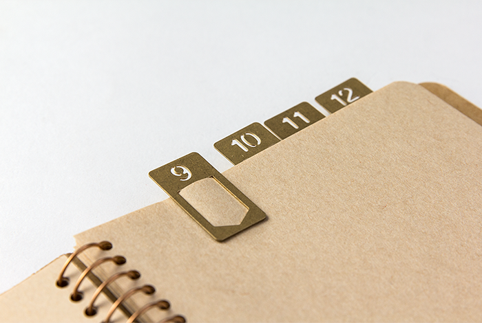 The Brass Midori Number Clips act as a  page marker.