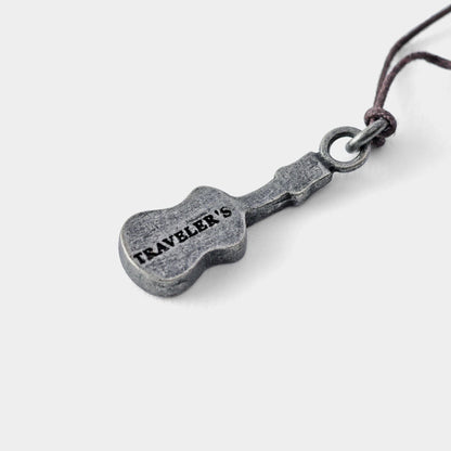 TRAVELER'S FACTORY Partner Shop Charm- Ukulele with 'TRAVELER'S' engraving on a white background
