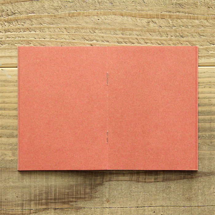 TRAVELER'S FACTORY Passport Refill features pink kraft paper.