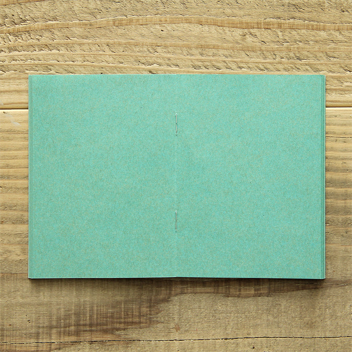TRAVELER'S FACTORY Passport Refill features turquoise kraft paper.