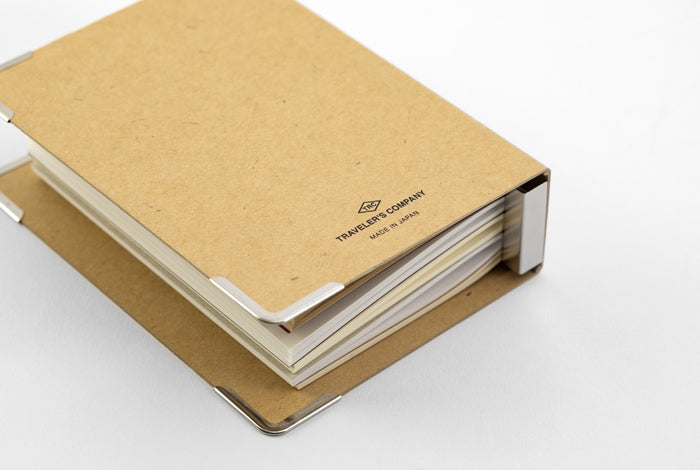 Kraft binder measures approximately 4.1 wide by 5.6 inches high by 1.6 inches deep.