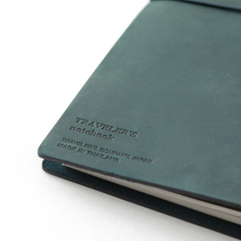 Each Blue Edition Midori Traveler's Notebook is branded with the logo and make information.