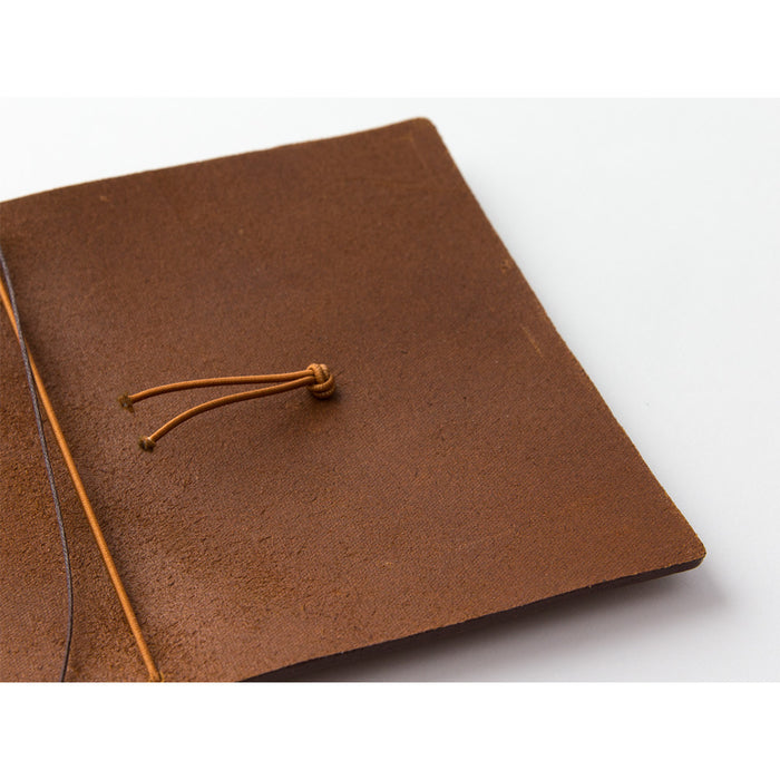 The camel leather cover is made by hand, like all TRAVELER'S notebook covers, in Chiang Mai, Thailand.