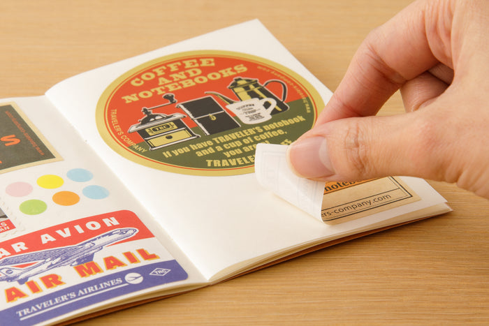 The notebook is crafted from the same smooth backing paper that is left after removing a sticker.