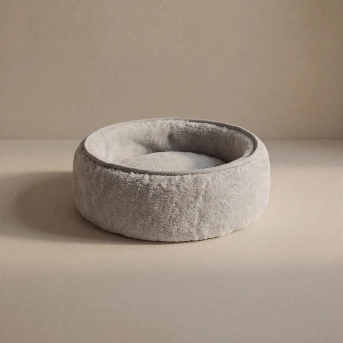 Soft wool alpaca pet bed, plush with a neutral color, ideal for small pets.