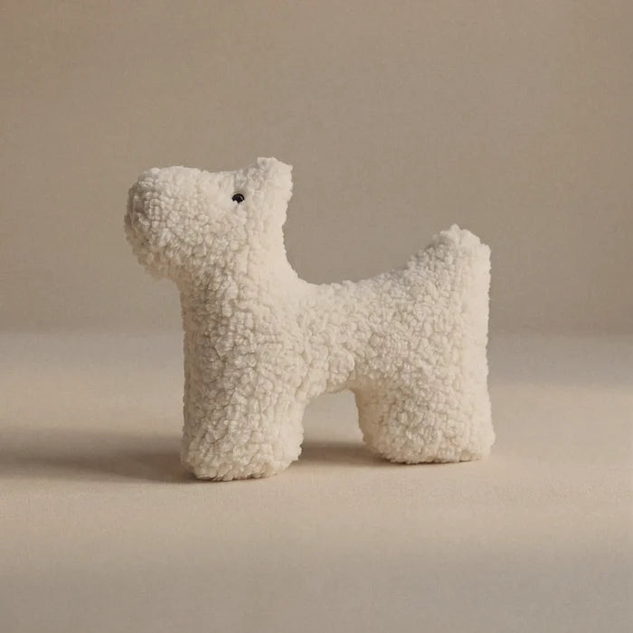 A small wool plush pet toy featuring a bouclé loop textured material, standing on a neutral beige background.