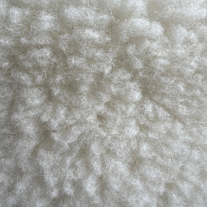 Soft wool sheep bouclé pet bed by with textural plush for pets.